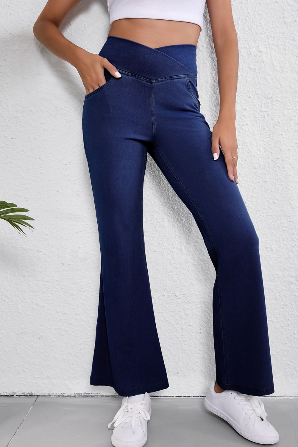 Dusk blue flare jeans with crossed waist