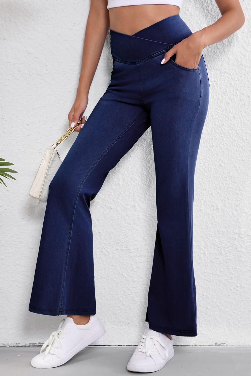 Dusk blue flare jeans with crossed waist