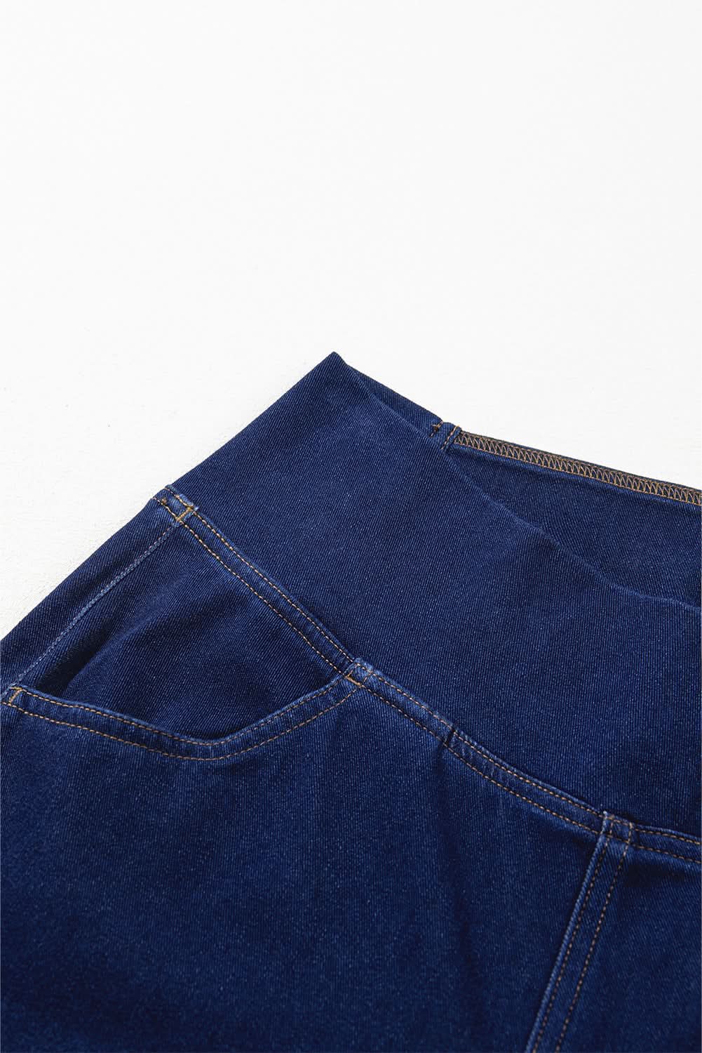 Dusk blue flare jeans with crossed waist